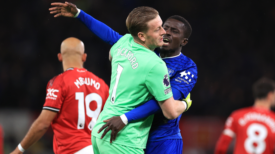 Everton goalkeeper Jordan Pickford pulls team-mate Idrissa Gana Gueye away after clashing with team-mate Michael Keane in the match against Manchester United