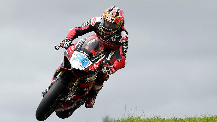 Davey Todd leaps through Acheson's on his way to victory in the Saturday Supersport race at Armoy in 2024