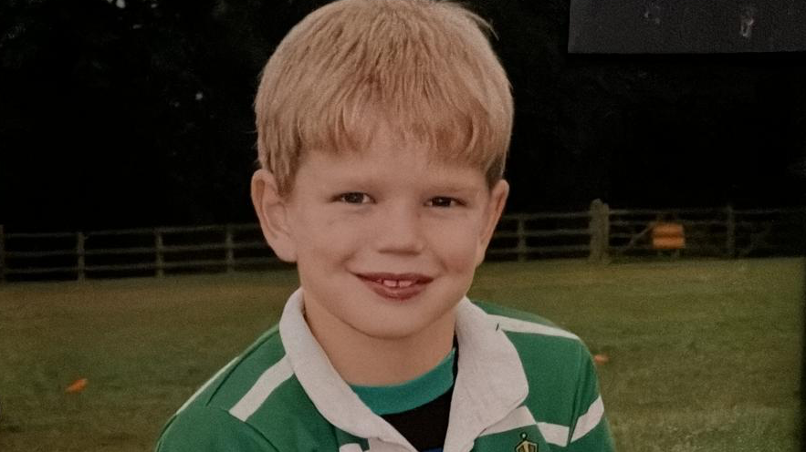 Picture of Henry Pollock in a green and white rugby shirt.