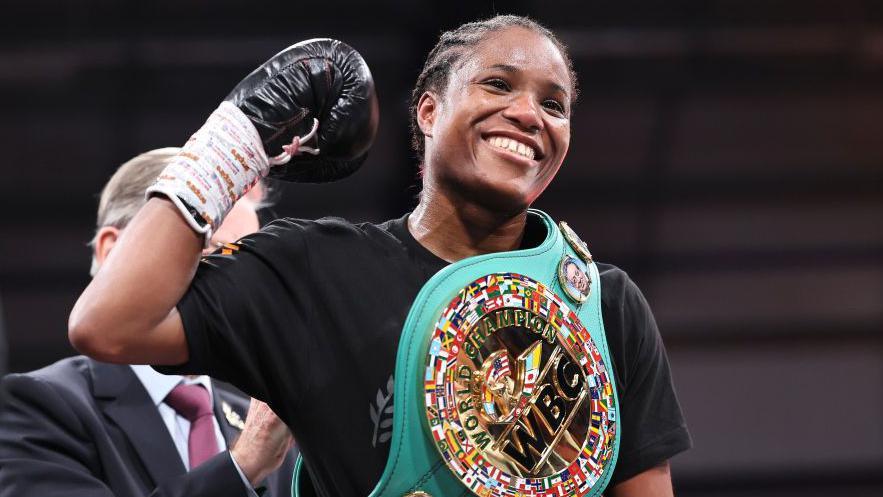 Caroline Dubois smiles with her WBC title around her shoulder
