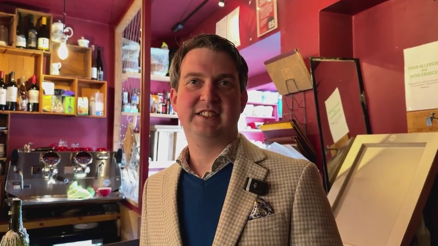 Roland Foxcroft, the owner of Cellar Magnifique in Woking, looks straight at the camera.