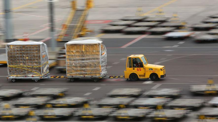  A vehicle transports air mail over the grounds of the DHL hub at the airport in Leipzig on March 07, 2019 in Leipzig, Germany