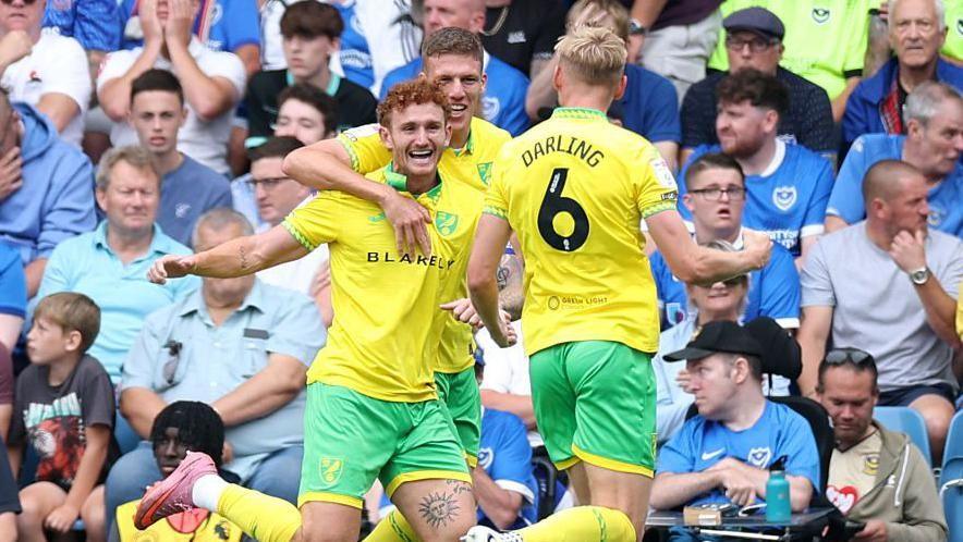 Norwich City celebrate after scoring their second goal against Portsmouth