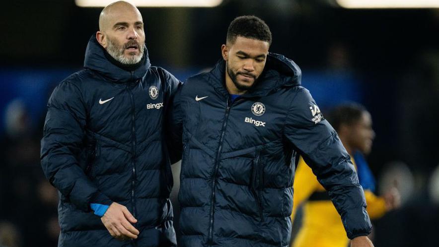 Enzo Maresca hugs Chelsea captain Reece James