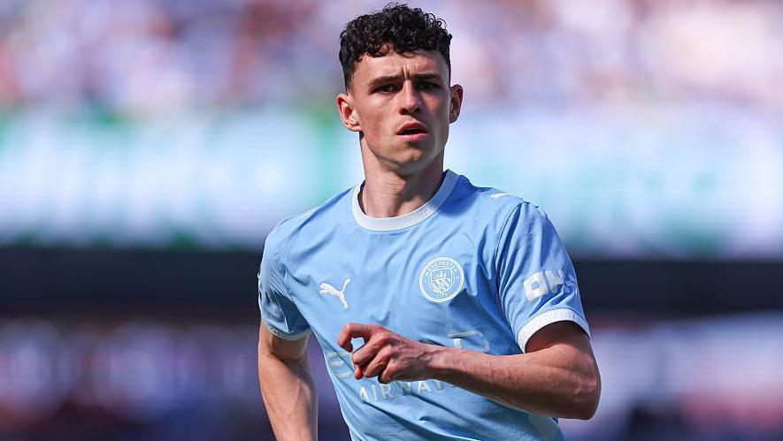 Phil Foden in action for Manchester City against Aston Villa in the Premier League