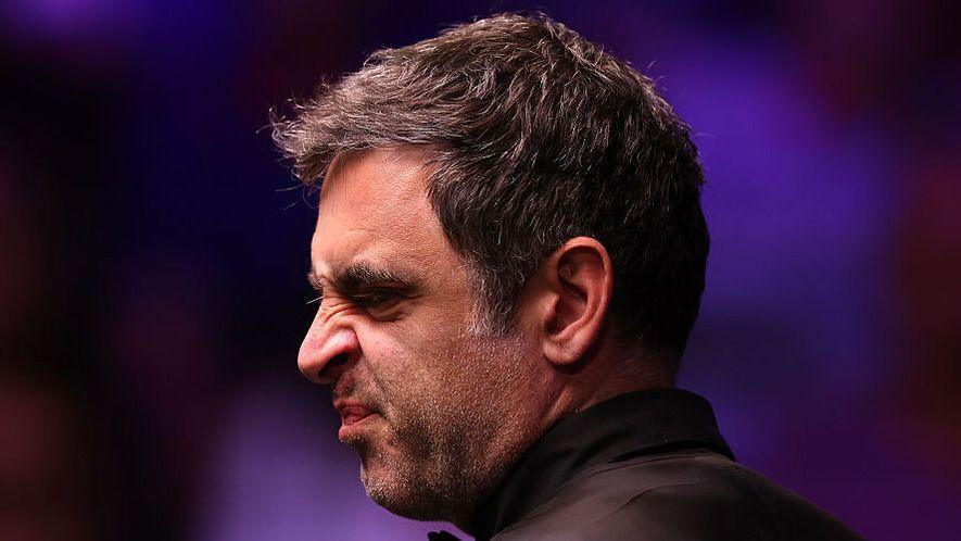 Ronnie O'Sullivan screws up his face during his match against Zhao Xintong at the World Snooker Championship