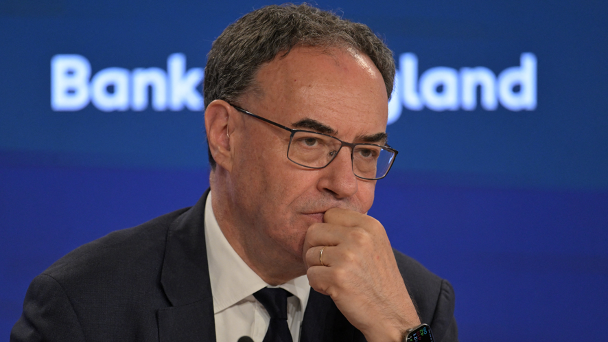 Governor of the Bank of England, Andrew Bailey during the Bank of England financial stability report press conference in July, 2026. He wears a dark jacket, white shirt and dark tie. 