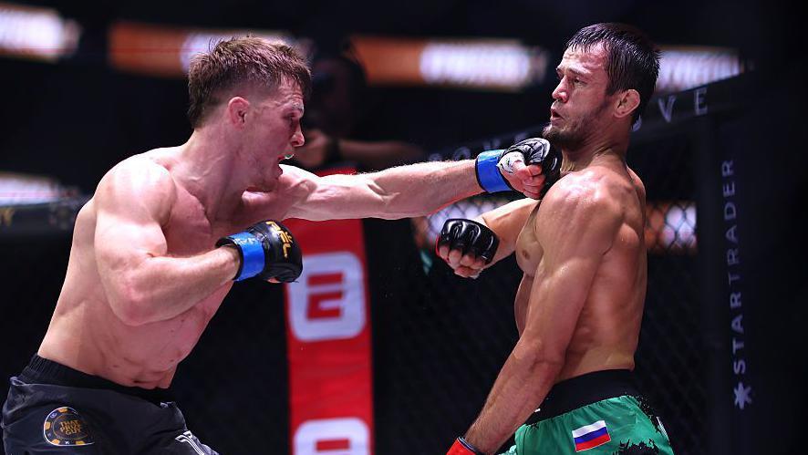 Paul Hughes punches Usman Nurmagomedov