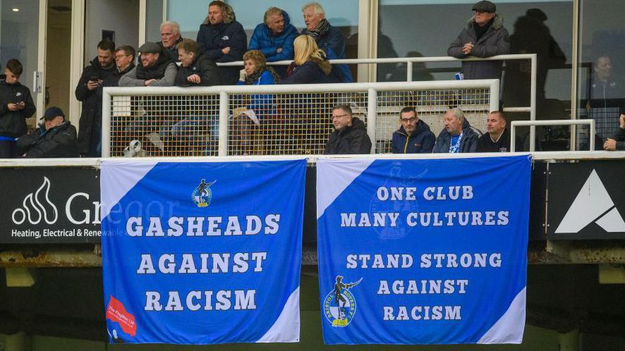 Two banners in support of Shaq Forde are displayed at the Memorial Stadium on Saturday during Bristol Rovers' League One fixture against Lincoln City