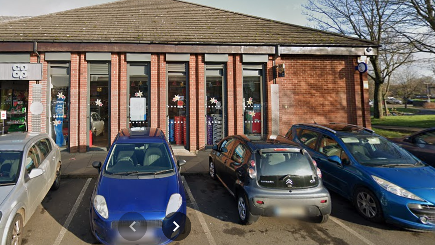 Four cars parked outside a Co-op supermarket