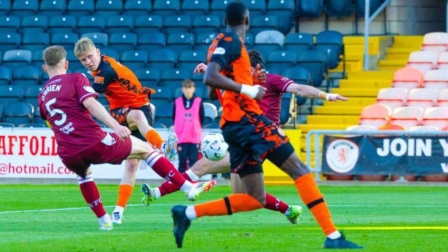 Dundee United's Zac Sapsford scores