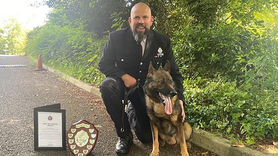 PC Oram and PD Bren with the Gary Mathison Trophy and certificate