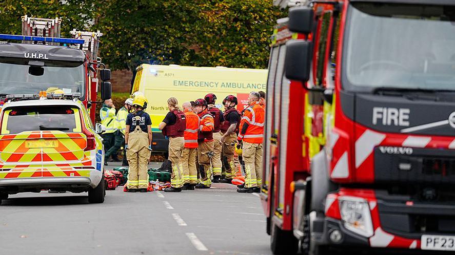 Emergency services and vehicles at the scene of an incident at Heaton Park Hebrew Congregation synagogue.