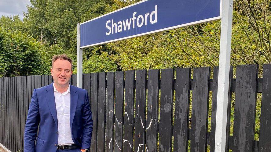 Danny Chambers beside Shawford station sign