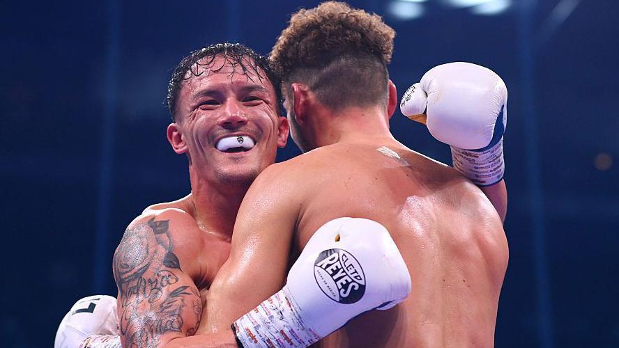 Josh Warrington and Leigh Wood hug