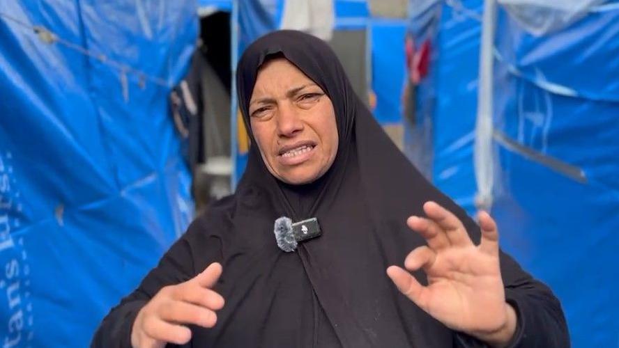 Displaced Palestinian Jamalat Wadi speaks to the BBC at a tent camp in Deir al-Balah, central Gaza (5 February 2025)