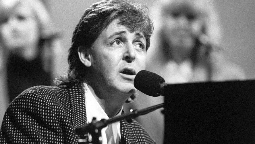 Paul McCartney singing and playing the piano