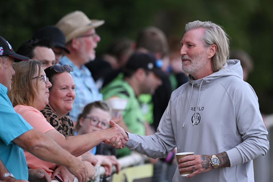 Forest Green Rovers boss Robbie Savage interacts with fans before a game