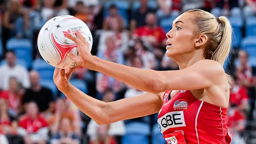 Helen Housby prepares to pass the ball 