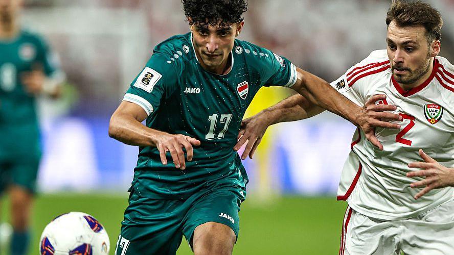 Iraq striker Ali Jasim (left) vies for the ball with UAE defender Ruben Canedo