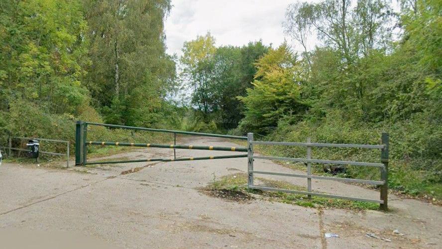A gate over a footpath under a railway line in west yorkshire 