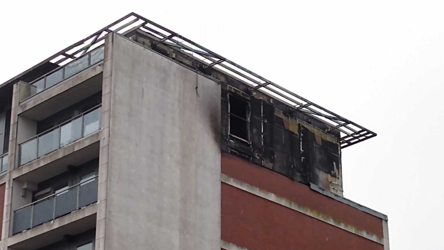 Damage on upper floors (sixth and seventh) to the side of the building in Slough. 