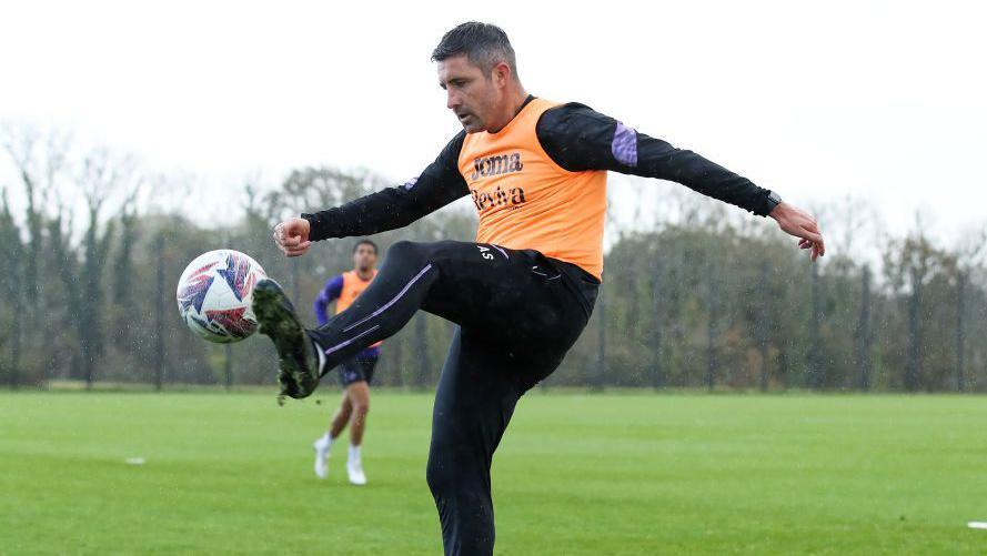 Alan Sheehan controls the ball during Swansea training 