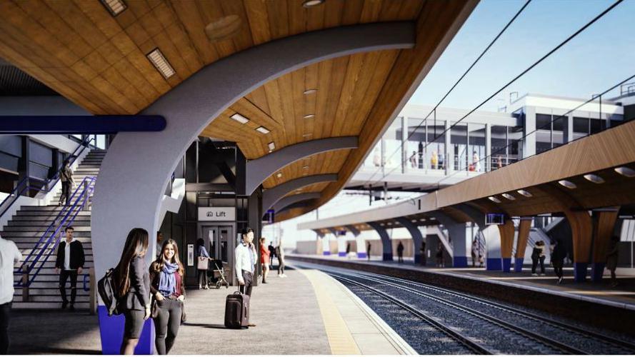 A computer-generated image of people stood by a widened train station platform under a curved wooden canopy. 