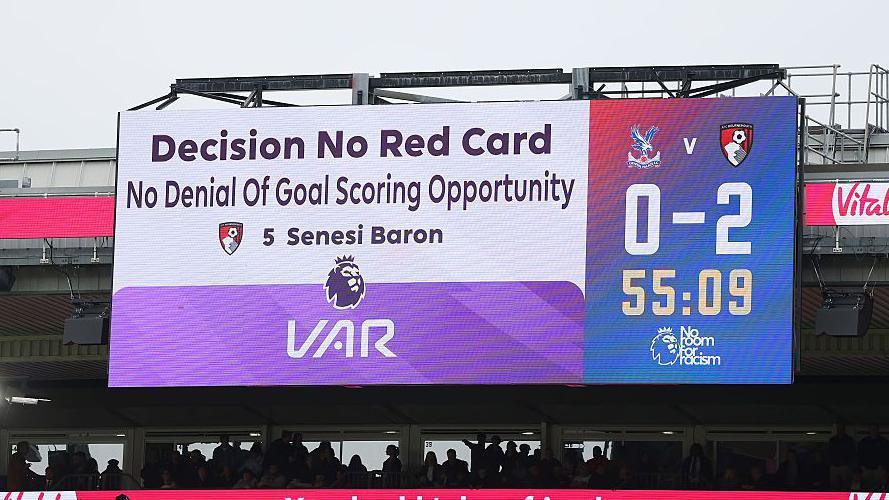 The LED board displays a message that reads 'Decision no red card, no denial of goal scoring opportunity'