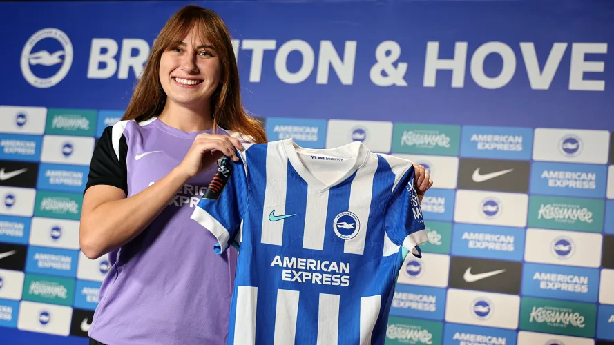 Olivia Garcia holds a Brighton shirt