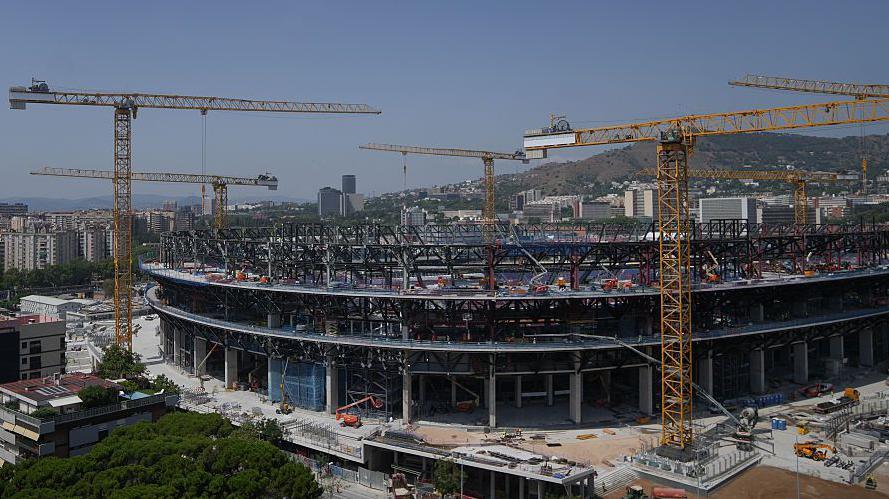 The Nou Camp with cranes around it