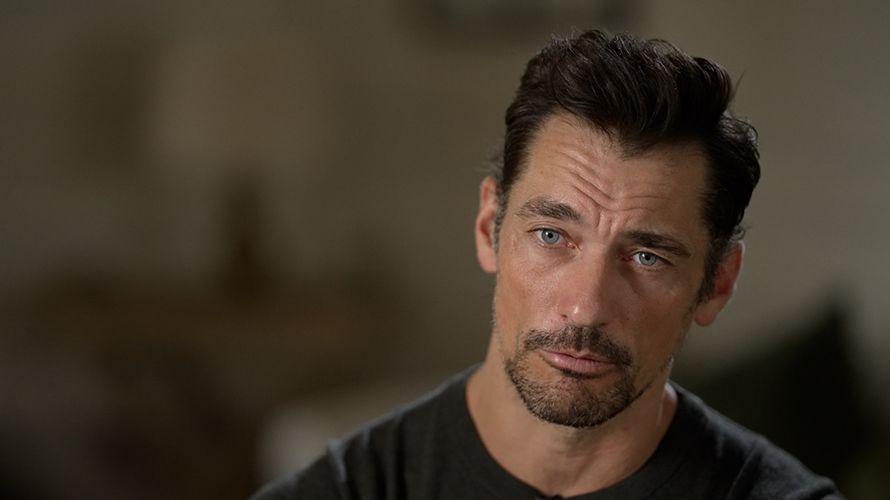 David Gandy is wearing a black t-shirt and has a serious expression on his face