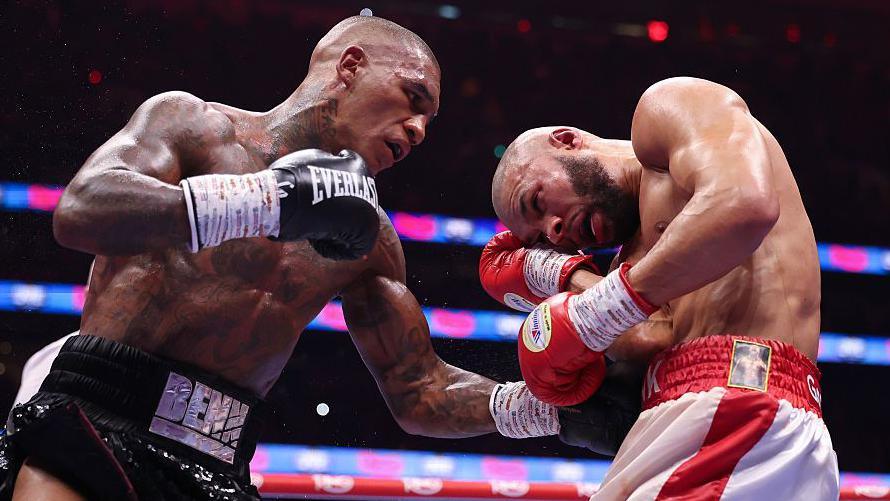 Conor Benn lands a punch to the body of Chris Eubank Jr