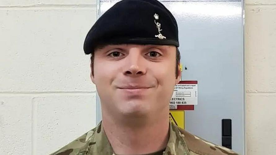 L/Cpl Mongan wearing his army uniform and also a black hat