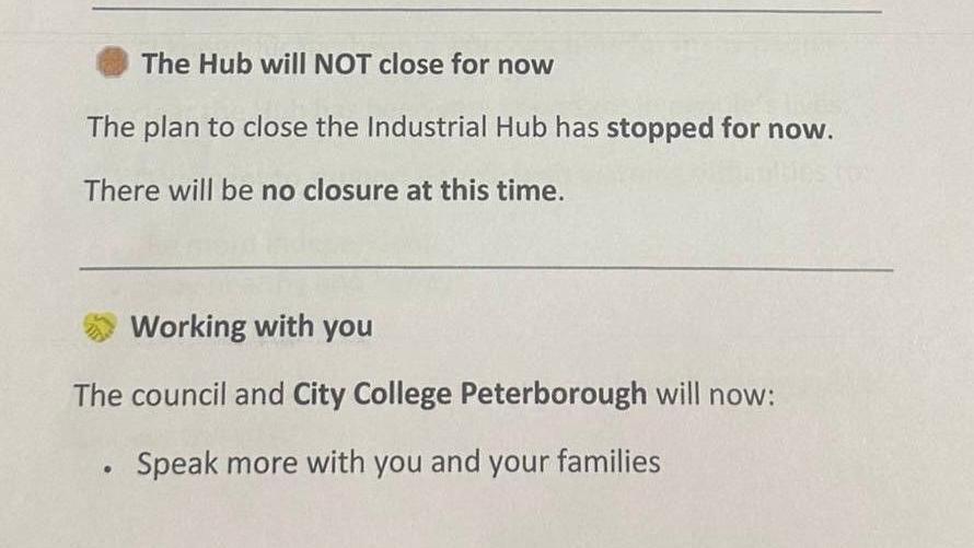 A white piece of paper with brown bullet point next to the words: "The Hub will NOT close for now. The plan to close the Industrial Hub has stopped for now. There will be no closure at this time."