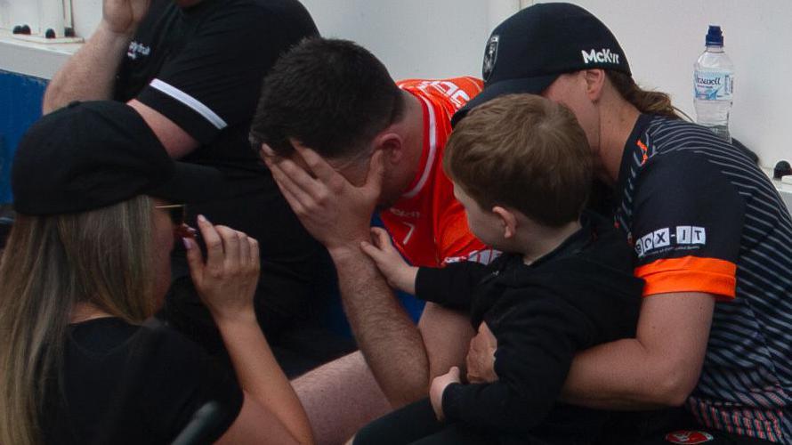 Aidan Forker's son Ross consoles the Armagh skipper after the Orchard men's penalty shootout hoodoo continued in last year's Ulster Final