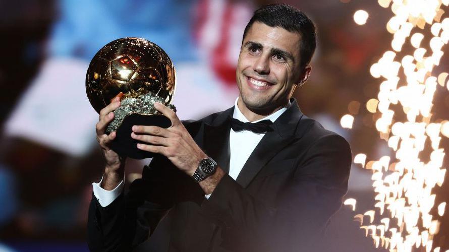 Manchester City's Spanish midfielder Rodri receives the Ballon d'Or award during the 2024 Ballon d'Or France Football award ceremony at the Theatre du Chatelet in Paris on October 28, 2024.