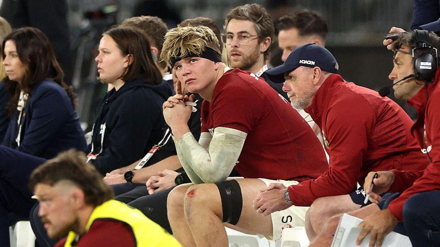 Henry Pollock watches the game from the sin-bin