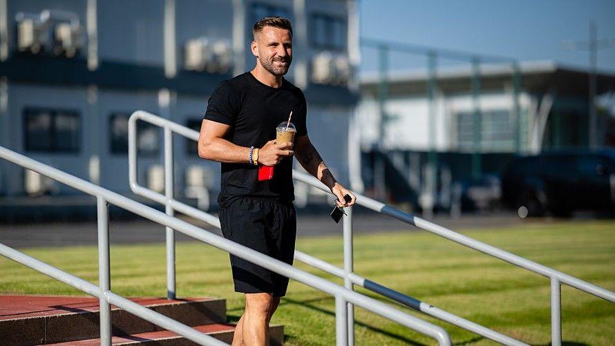 Manchester United defender Luke Shaw on the steps at Carrington
