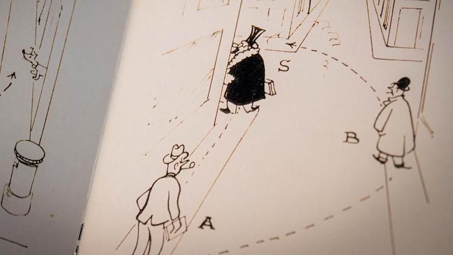 A page from a training guide shows three cartoon men, labelled a, b, and s. They are triangulated on a street and a dotted line shows the path that a spy is intended to take. The men all wear hats.