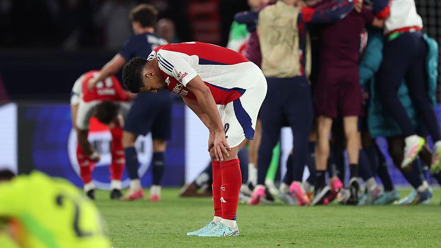William Saliba looks down dejected after defeat