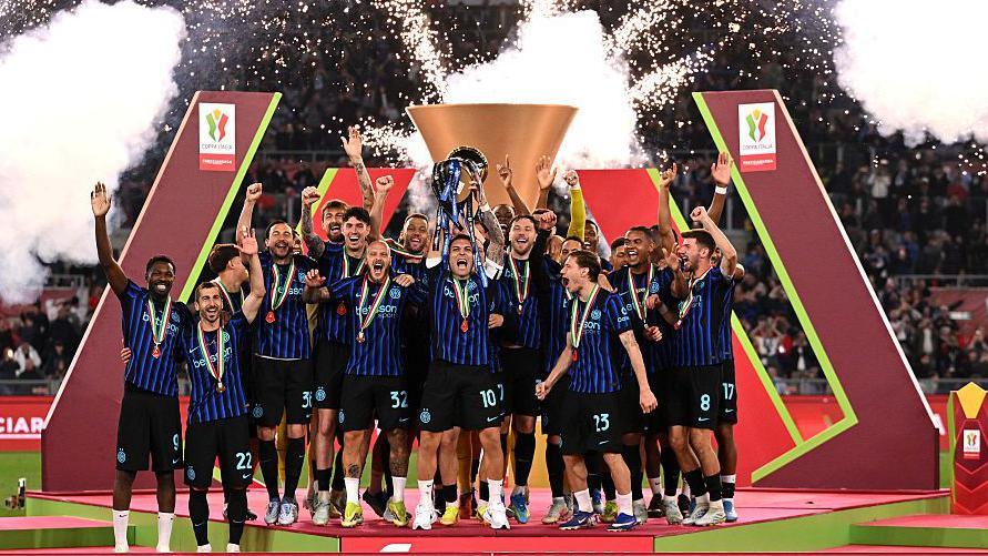 Inter Milan lift the Coppa Italia trophy after the team's victory in the Coppa Italia Final match between Lazio and Inter Milan at Stadio Olimpico on May 13, 2026.
