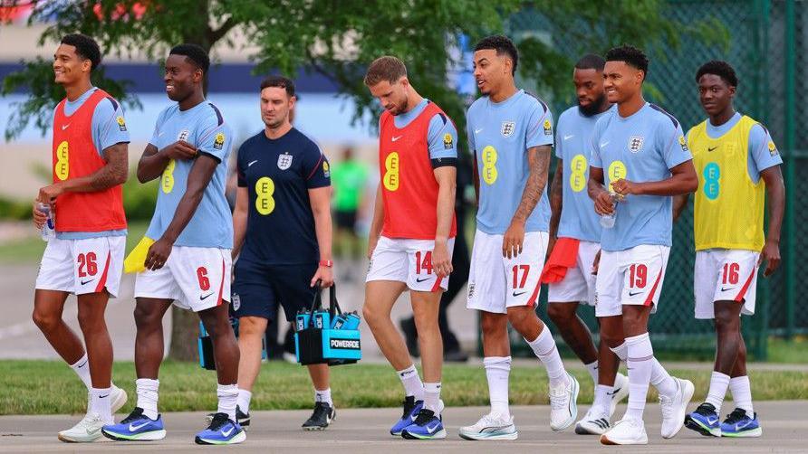 England players head to the pitch to warm up before a friendly against Sporting Kansas City