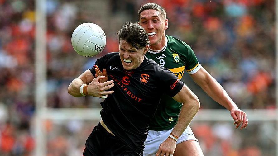 Armagh's Joe McElroy is challenged by Kerry's Joe O'Connor during the 2025 All-Ireland quarter-final