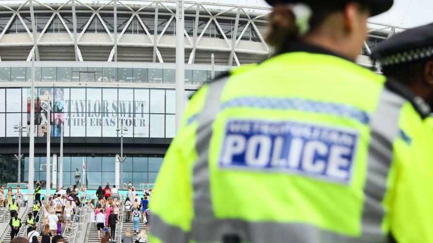 A police officer stands outside Wembley Stadium ahead of Taylor Swift's performance on August 15, 2024 in London