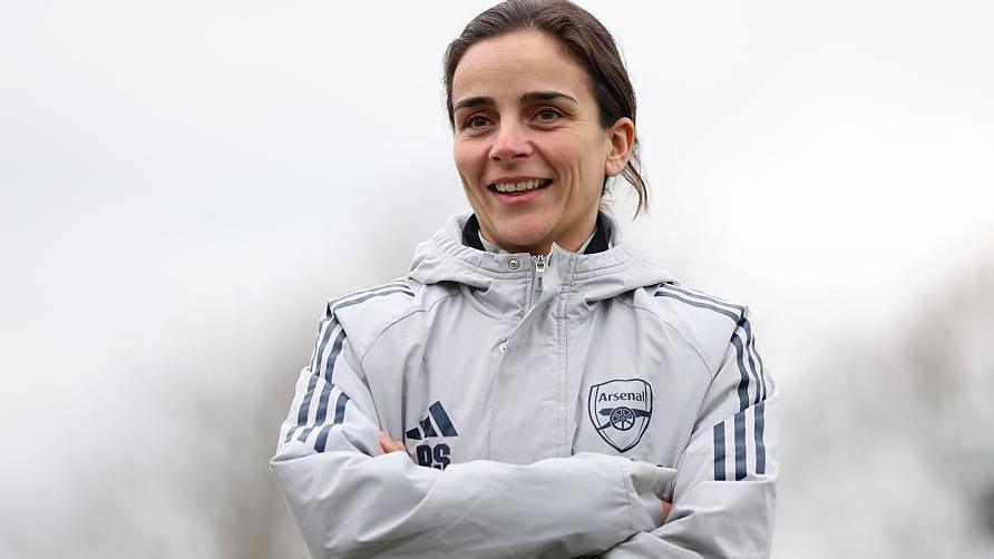 Renee Slegers stood with her arms folded