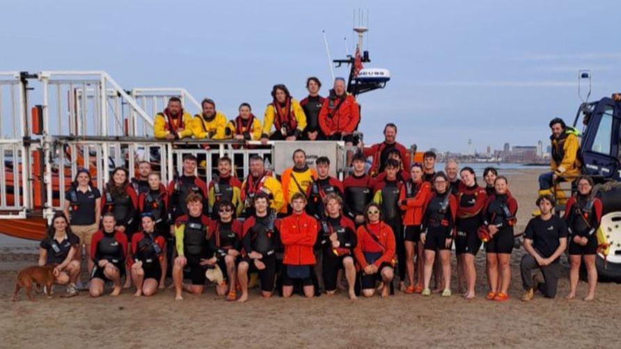 Group photograph of Wirral RNLI Lifeguards on beach