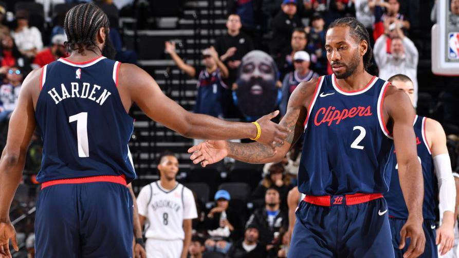 James Harden and Kawhi Leonard celebrate