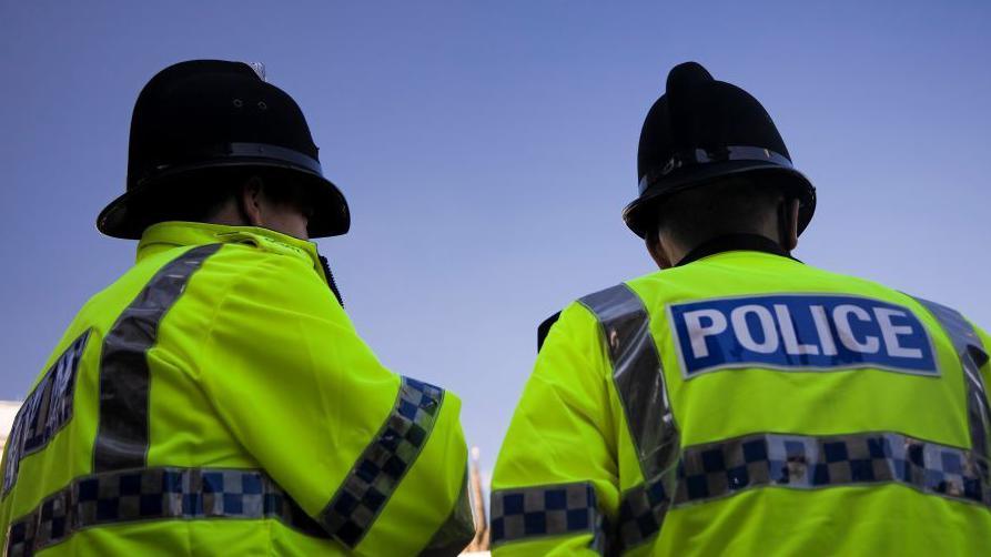 Two police officers in hi-vis jackets