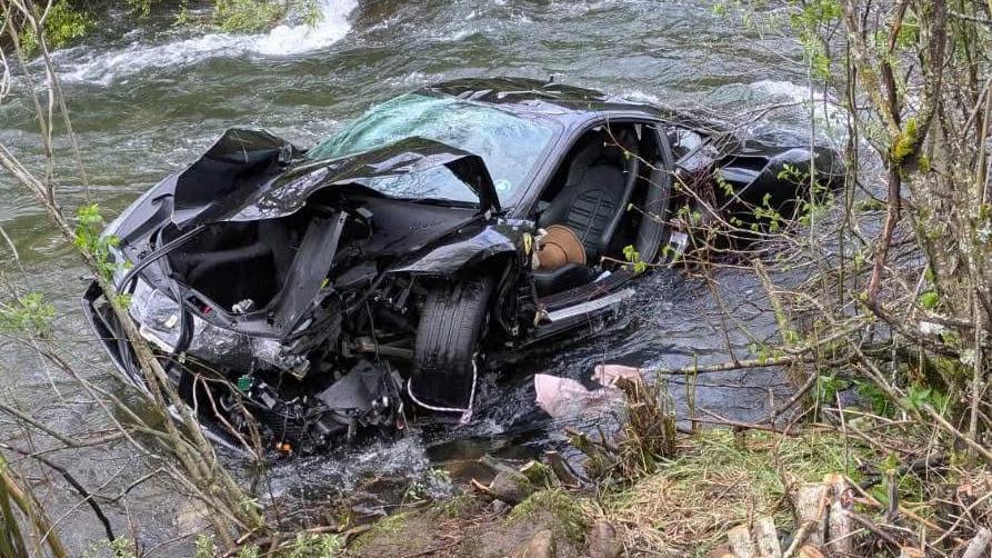 The wreckage of a sports car car that was found plunged into a river in Northern Spain on Sunday
